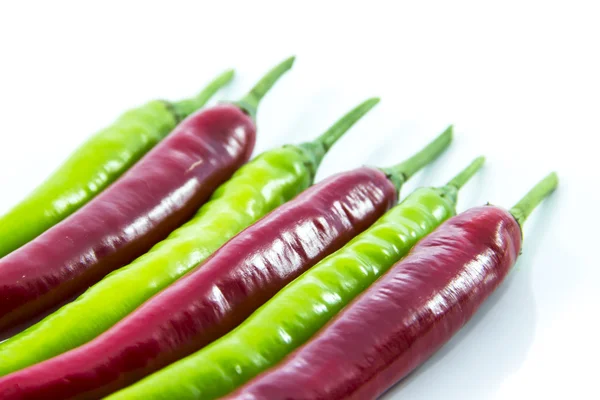 Half green switched red chili pepper — Stock Photo, Image