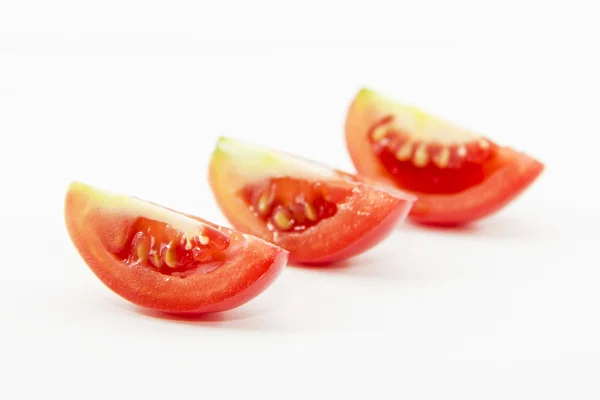 Fresh tomatoes sliced in pieces — Stock Photo, Image