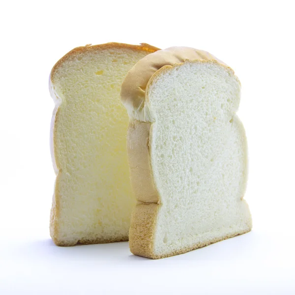 Нарезанный белый толстый хлеб с золотым краем — стоковое фото