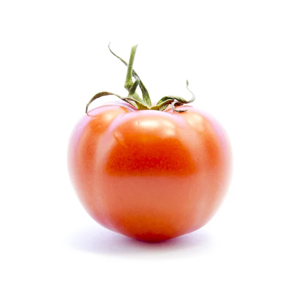 Röd tomat med grön pinne — Stockfoto