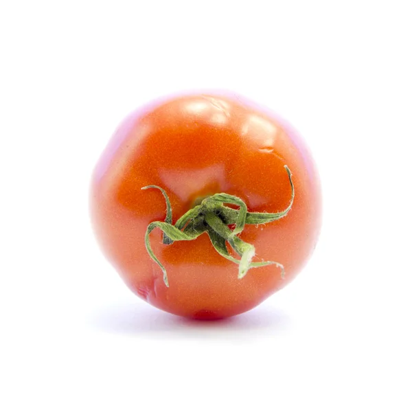 Röd tomat med grön pinne — Stockfoto