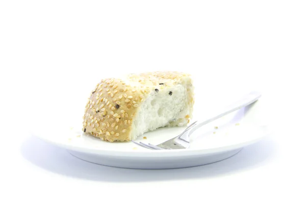 Whole grain half sliced bread on white plate — Stock Photo, Image