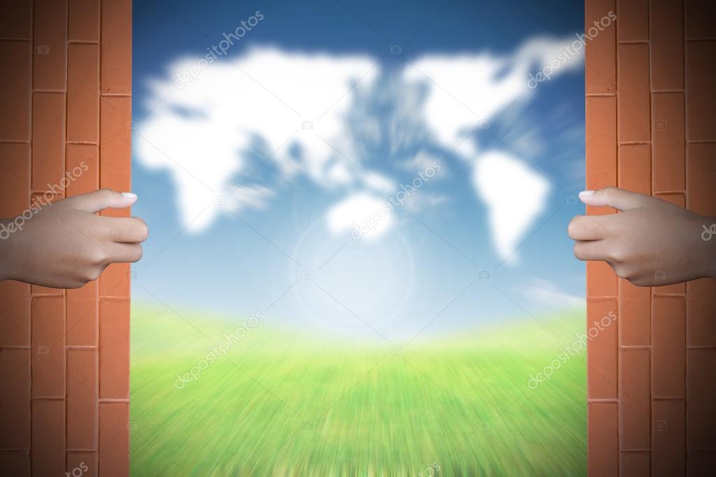 Two hands to open the door world map background