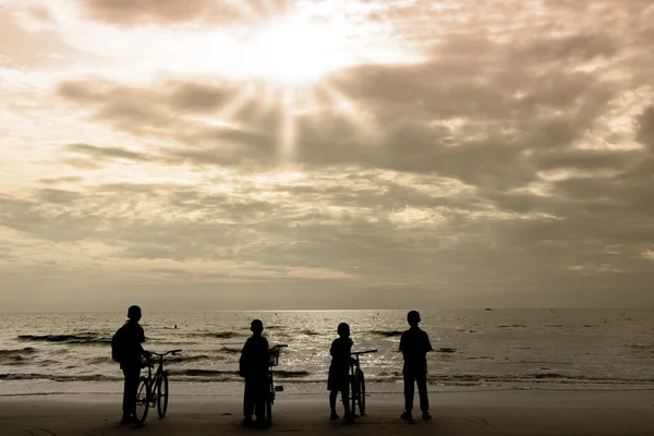 Cycling silhouette children.Sea background — Stock Photo, Image