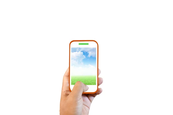 Manos hacia nosotros teléfono de pantalla táctil humana, hierba y cielo . —  Fotos de Stock