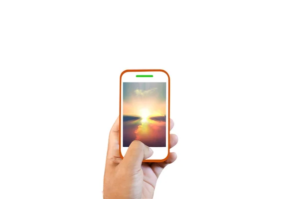 Mano sosteniendo Smartphone blanco con pantalla de puesta de sol sobre fondo blanco —  Fotos de Stock