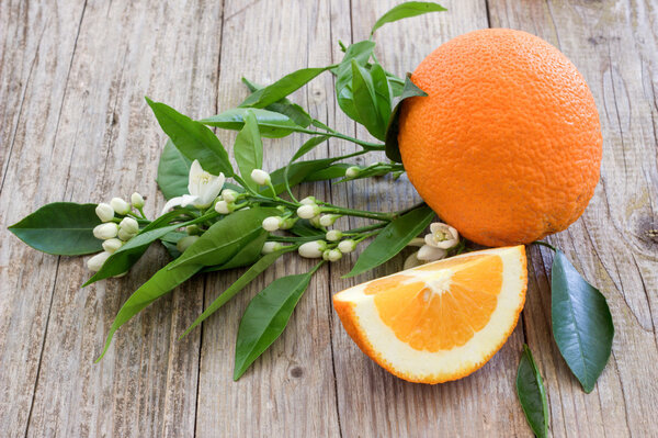 Orange on a wooden board.