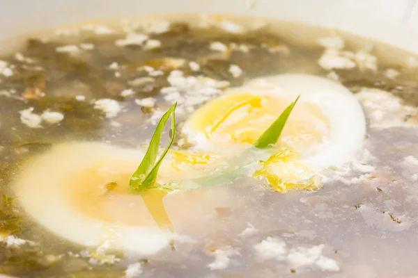 Vegetable sorrel soup with egg in a plate — Stock Image Vegetable sorrel soup with egg in a plate Stock Picture