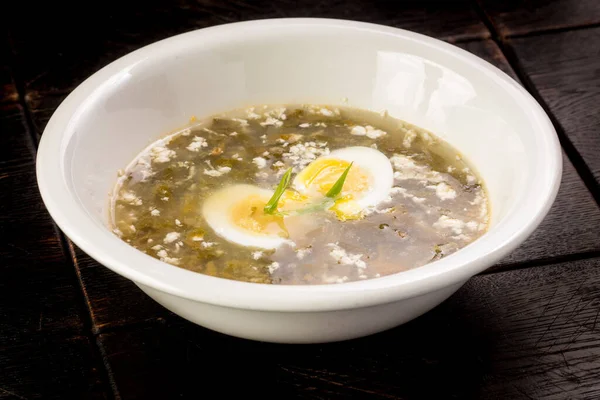 Vegetable sorrel soup with egg in a plate — Stock Image Vegetable sorrel soup with egg in a plate Stock Image