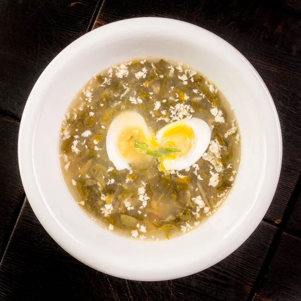 Vegetable sorrel soup with egg in a plate — Stock Image Vegetable sorrel soup with egg in a plate Royalty Free Stock Images