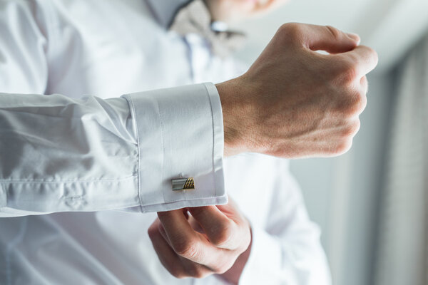 hands of the bride buttoned cuffs, a close-up