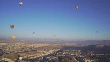 soaring balloons, Cappadocia, Turkey. Panorama filmed in flight as the sun rises