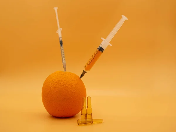 Genetically Modified Product Gmo Orange Grapefruit Syringe Isolated Background Gold — Stock Photo, Image