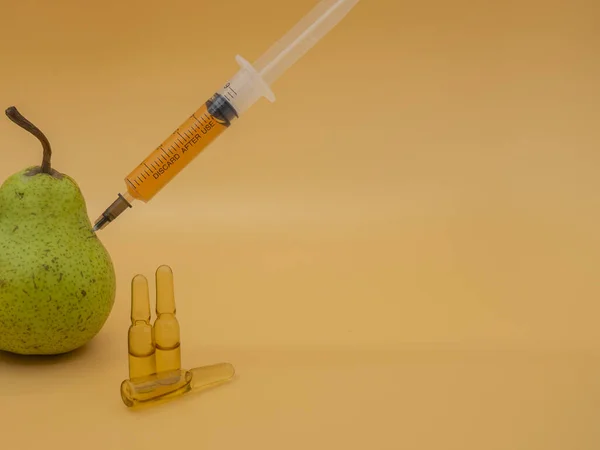 Genetically Modified Product Gmo Green Pear Syringe Isolated Background Gold — Stock Photo, Image