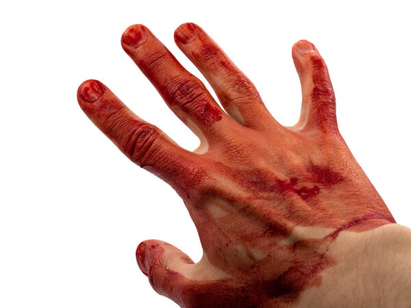 The man's hand and fingers are covered with drops and splashes of blood. Stop gesture. The concept of the victim of a maniac, a killer after a fight. Trauma, bleeding.