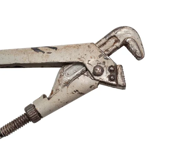 Gas aligator adjustable, tubular wrench (Swedish type). A close-up photo of an old, peeling, rusty instrument on a white, isolated background. The concept of classics and reliability.