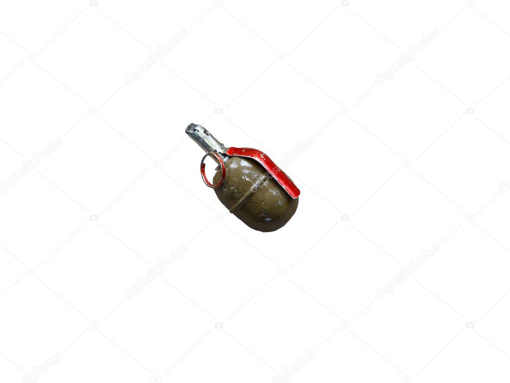 A green hand held offensive grenade lies on its side on the gray concrete floor. The photo is isolated on a white background. The concept of news about defusing terrorism is an act of attack.