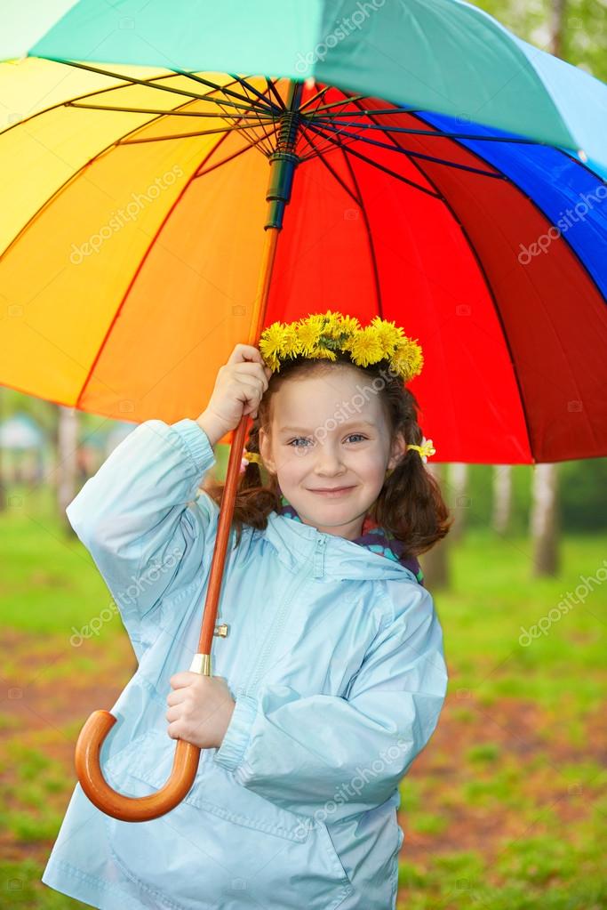 Little girl with a rainbow umbrella Stock Photo by ©Marynka 61448549
