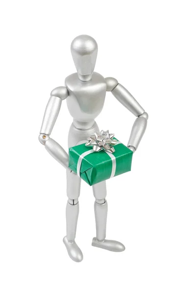 Silver marionette holding a green gift box with big silver bow. — Stock Photo, Image