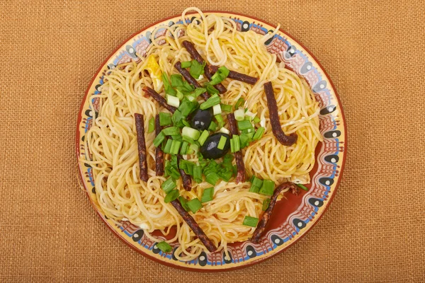 Spaghetti sausage on sacking — Stock Photo, Image