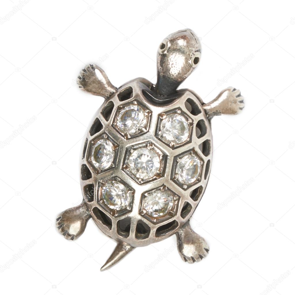 Silver turtle pendant with diamonds on a white background