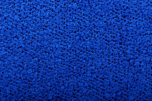 Lavorato a maglia ricci sfondo blu — Foto Stock