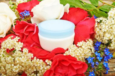 Cream on a bouquet of red roses