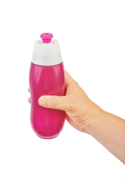 Sport beverage bottle in hand — Stock Photo, Image