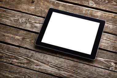 Eski ahşap masa üzerinde dijital tablet