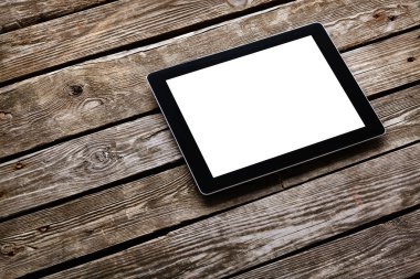 Eski ahşap masa üzerinde dijital tablet