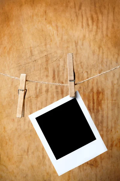 Instant photo on the clothesline — Stock Photo, Image