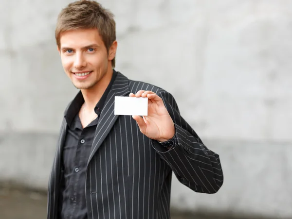 Businessman showing business card — Stock Photo, Image