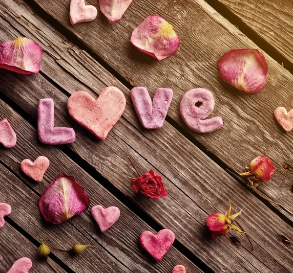 Word Love with rose petals — Stock Photo, Image