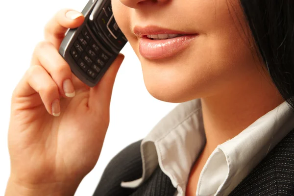 Woman smiling and talking by cell phone — Stock Photo, Image