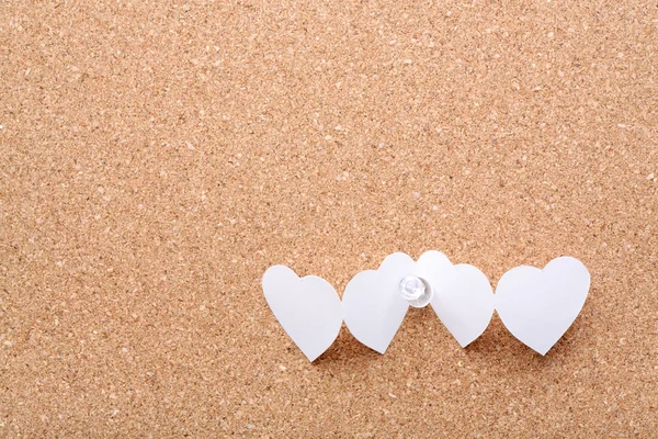 Paper hearts in chain with white pin — Stock Photo, Image