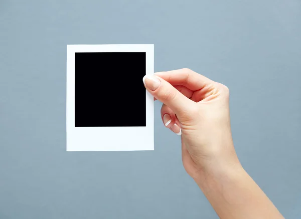 Instant photo in hand — Stock Photo, Image