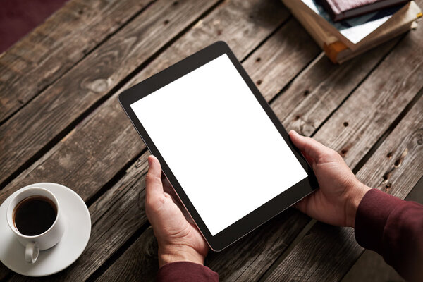 Tablet computer with isolated screen in male hands