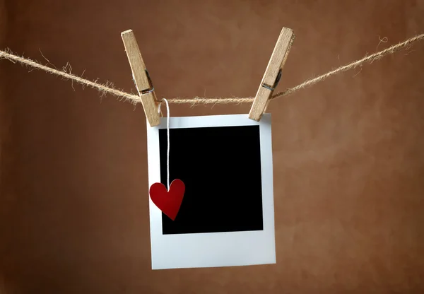 Instant photo and paper heart — Stock Photo, Image