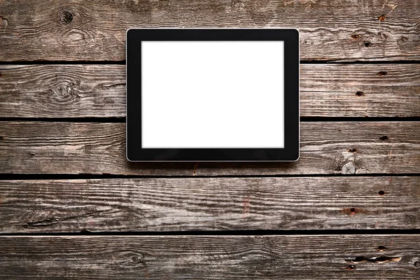 Digitales Tablet auf altem Holztisch — Stockfoto