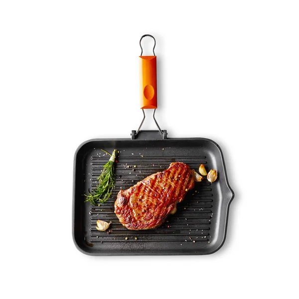 Marbled beef steak in a grill pan — Stock Photo, Image