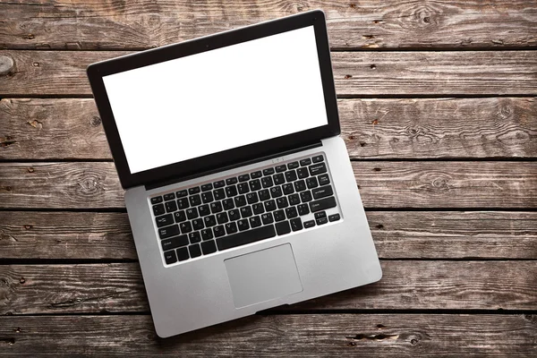 Open laptop on old wooden desk