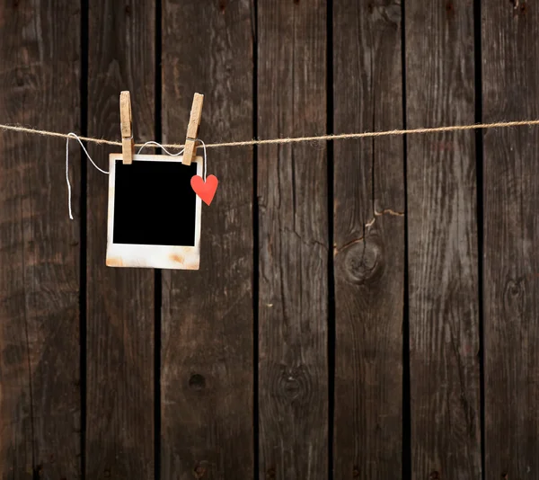 Blank instant photo and paper heart — Stock Photo, Image