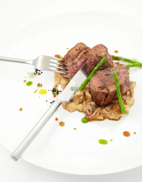 Veal sirloin steaks with fork and knife — Stock Photo, Image