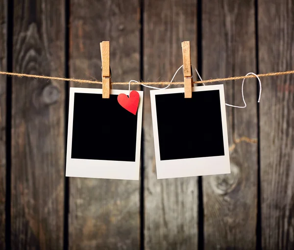 Blank instant photos and paper heart — Stock Photo, Image