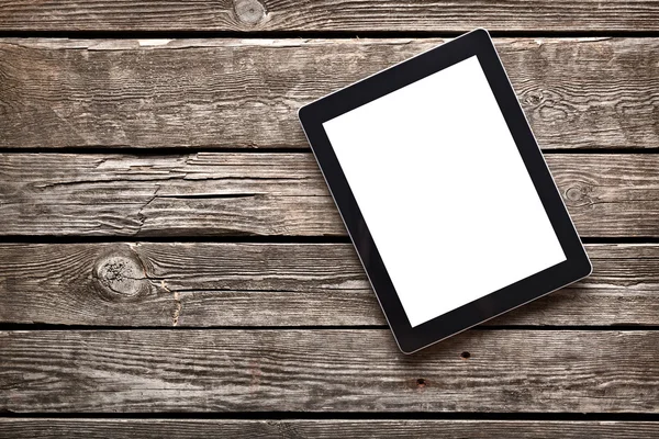 Digital tablet on old wooden desk — Stock Photo, Image