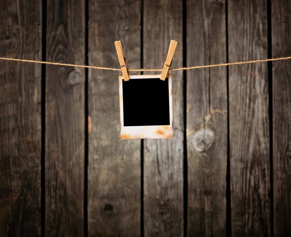 Blank instant photo on the clothesline — Stock Photo, Image