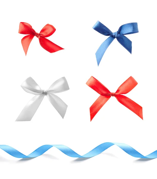 Stack of four satin bows and ribbon — Stock Photo, Image