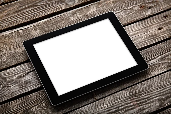 Digitales Tablet auf altem Holztisch — Stockfoto