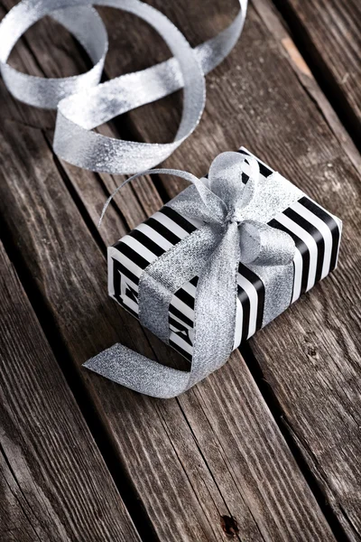 Gift box tied big silver bow — Stock Photo, Image