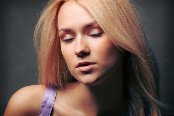 Woman with closed eyes and open mouth